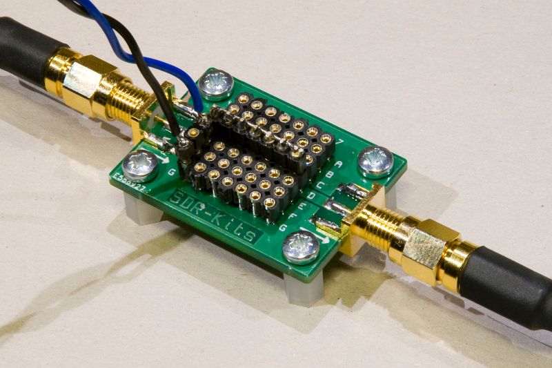 VNWA test board with through connection (strip along the center) and shunting connection to the sense coil.