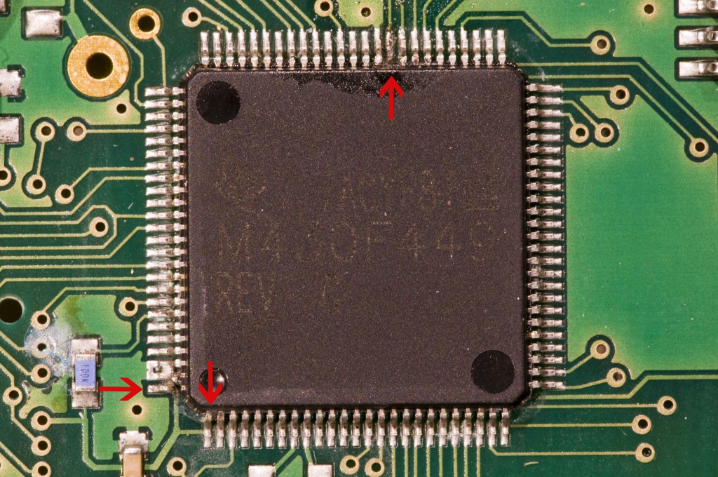 The processor with arrows pointing to the damaged pins.