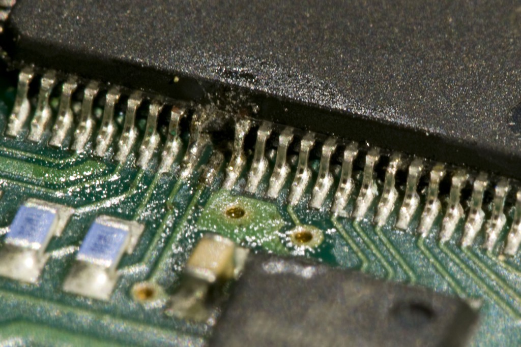 Closeup of pin 60 (after I desoldered the lower remains of the pin).